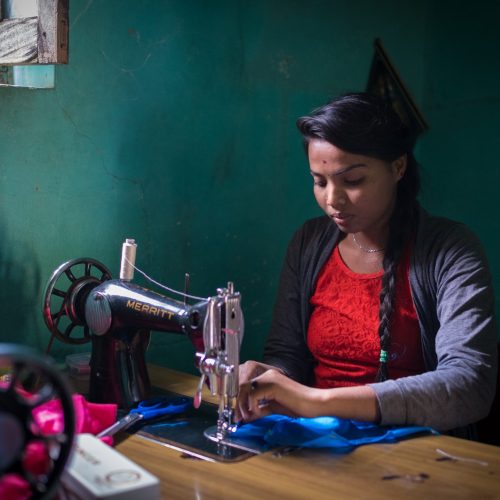 Learning to make clothing at Hosur Bande